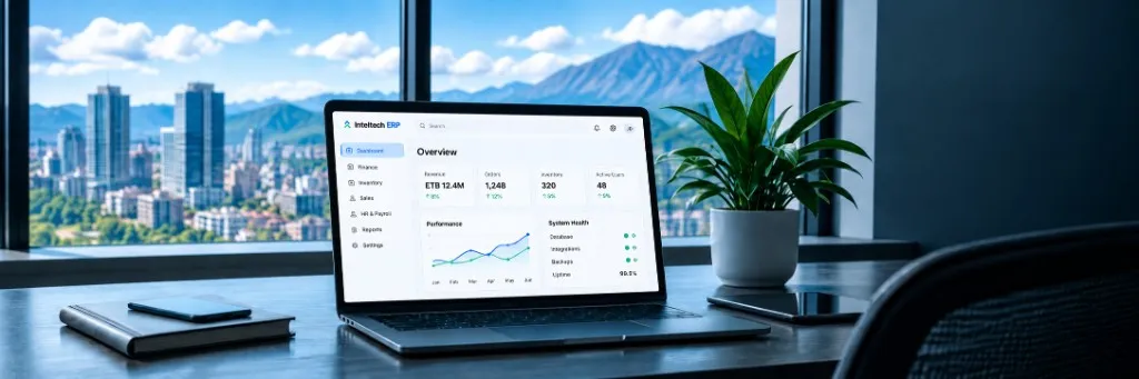A laptop on an office desk showing an ERP dashboard